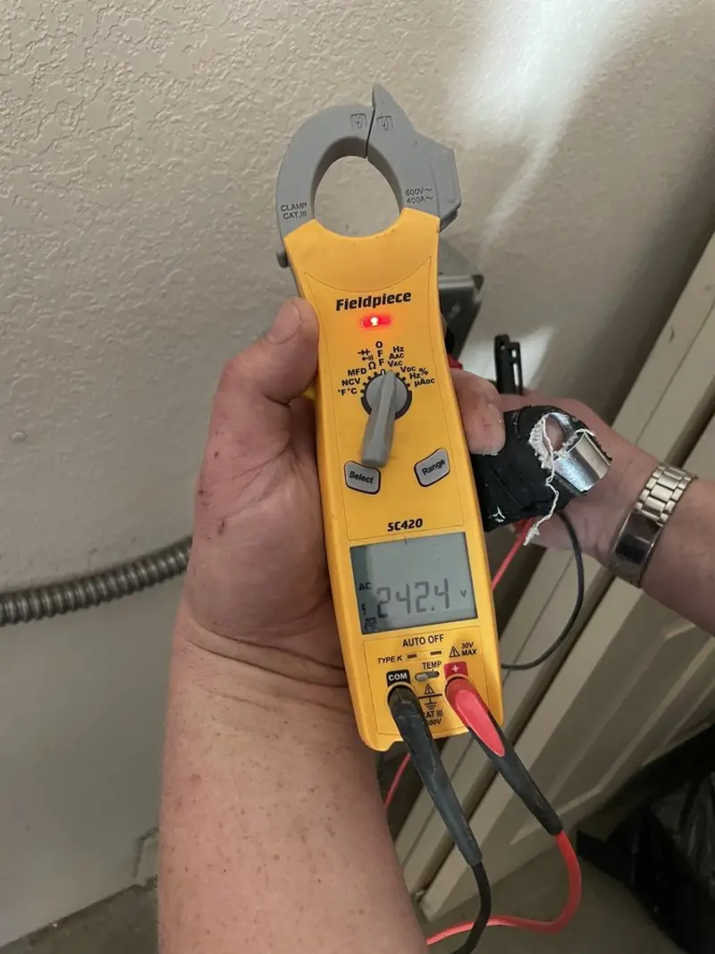 Voltage testing with clamp meter during Outlet Installation in Fullerton